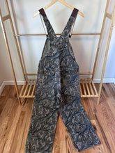 Load image into Gallery viewer, Carhartt Mossy oak tree stand hunting camo vintage overalls men’s size Large/Medium made in USA camo hunting bibs 80s 90s