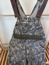 Load image into Gallery viewer, Carhartt Mossy oak tree stand hunting camo vintage overalls men’s size Large/Medium made in USA camo hunting bibs 80s 90s