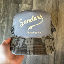 Load image into Gallery viewer, Vintage Trebark Camo Sanders Building Mart Trucker Hat