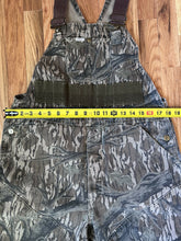 Load image into Gallery viewer, Carhartt Mossy oak tree stand hunting camo vintage overalls men’s size Large/Medium made in USA camo hunting bibs 80s 90s