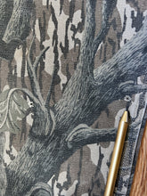 Load image into Gallery viewer, Carhartt Mossy oak tree stand hunting camo vintage overalls men’s size Large/Medium made in USA camo hunting bibs 80s 90s