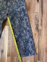 Load image into Gallery viewer, Carhartt Mossy oak tree stand hunting camo vintage overalls men’s size Large/Medium made in USA camo hunting bibs 80s 90s