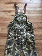 Load image into Gallery viewer, Vintage Carhartt insulated lined overalls bibs vintage duck hunting camo made in USA men’s size 36x30 Union made