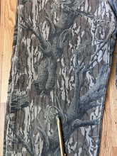 Load image into Gallery viewer, Carhartt Mossy oak tree stand hunting camo vintage overalls men’s size Large/Medium made in USA camo hunting bibs 80s 90s