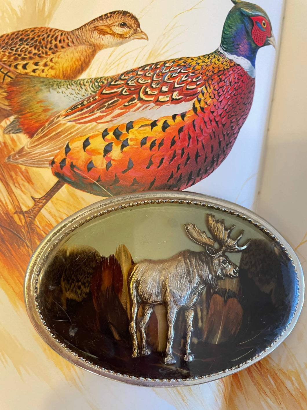 Moose Belt Buckles with Pheasant Feather Backdrop