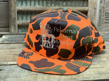 Load image into Gallery viewer, Pekarna&#39;s Meat Market Jordan, MN Orange Camo Hat